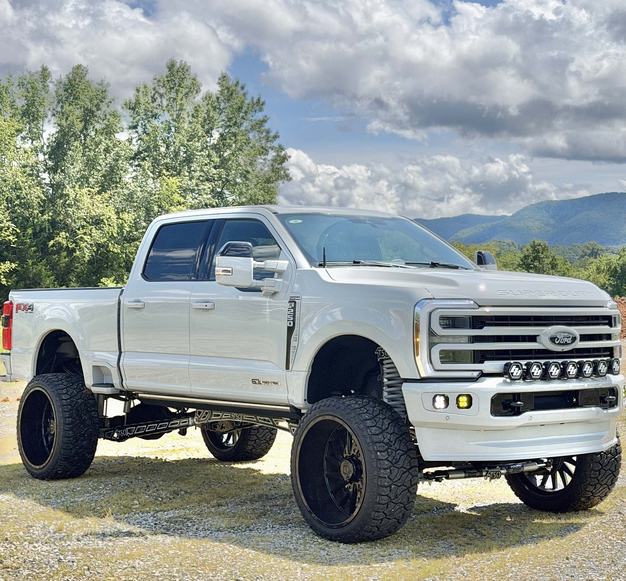 Avalanche Grey 2026 Ford F250 on a 8" TSO Mini Cradle 4 Link Lift Kit on 26x14 TIS wheels